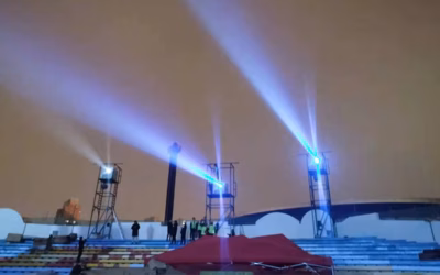 Two Barco UDX-4K40 projectors housed in custom air-cooled enclosures mounted on a structural column at Shenzhen Happy Valley